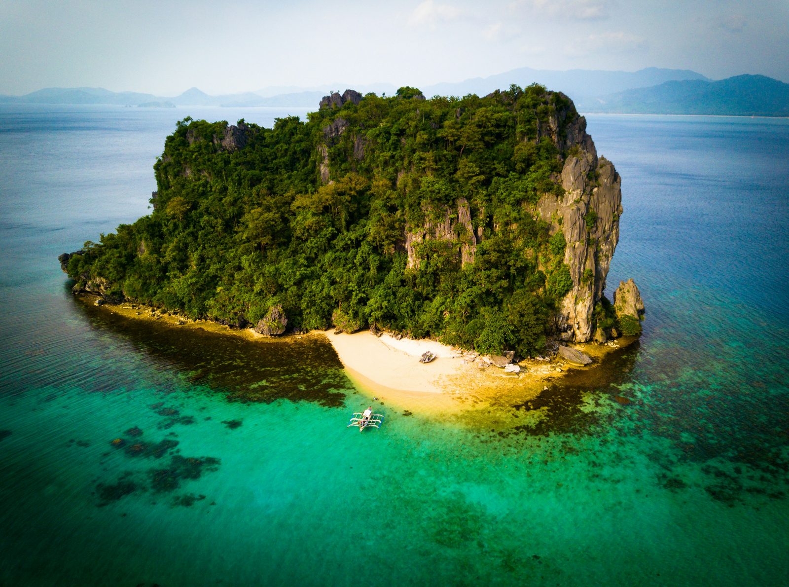 Aerial photography of islet during daytime
