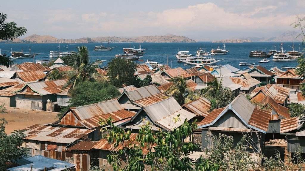 A group of boats floating on top of a body of water