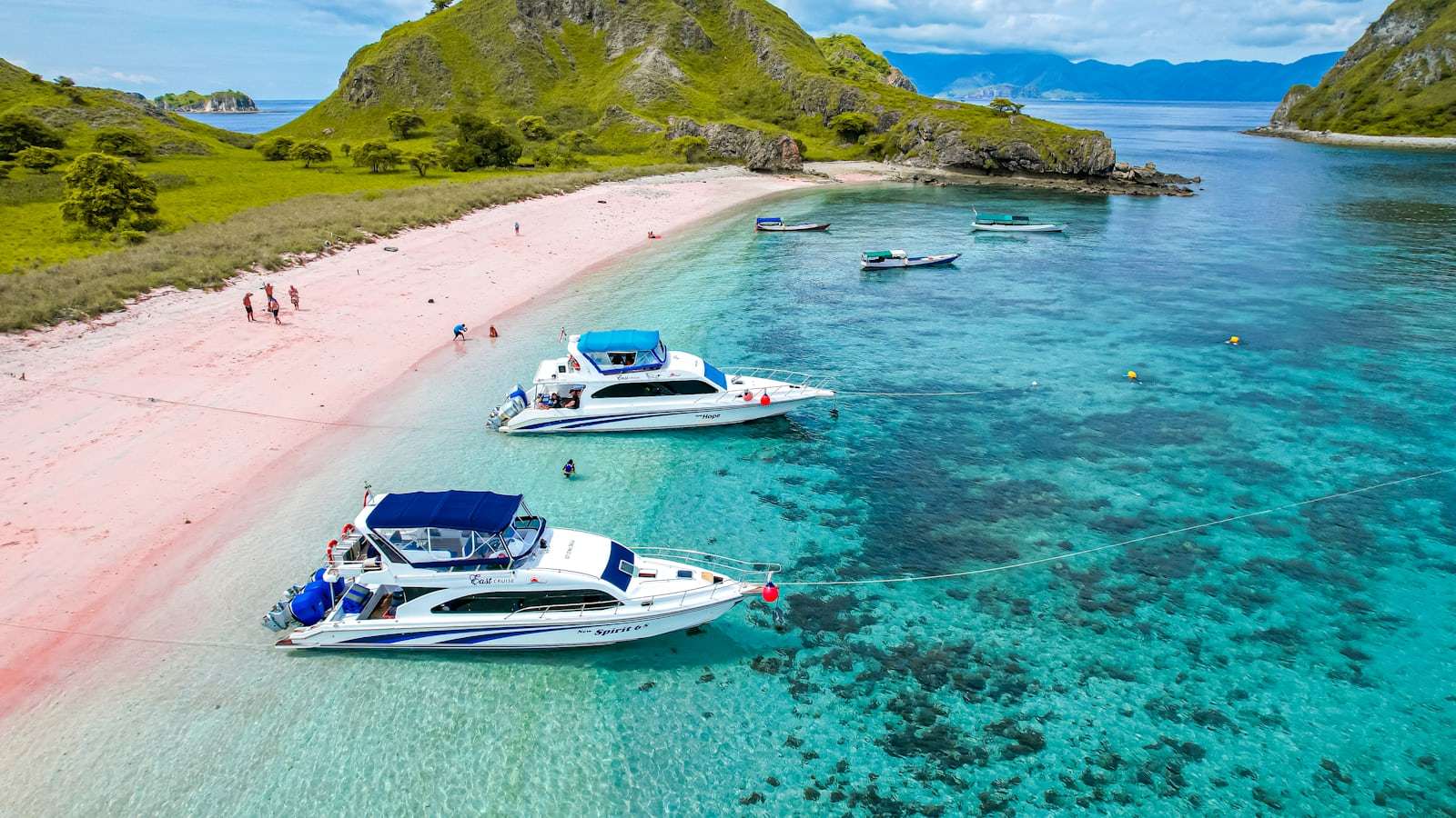 A group of boats that are sitting in the water