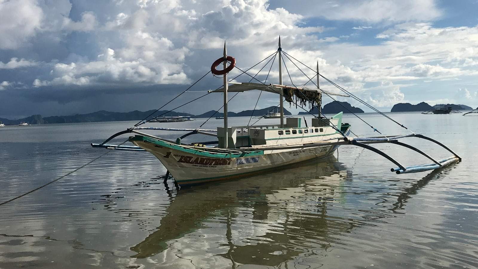 A boat sitting in the middle of the water