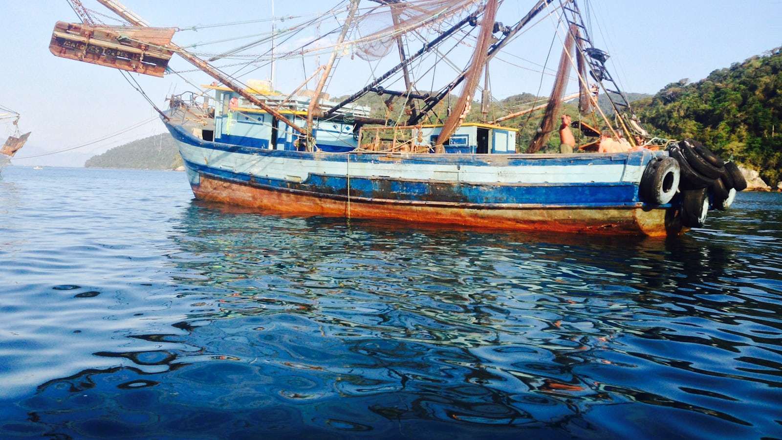 Brown and white boat on water during daytime