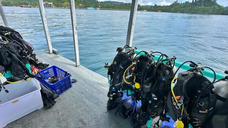 Scuba gear ready on a dive boat deck