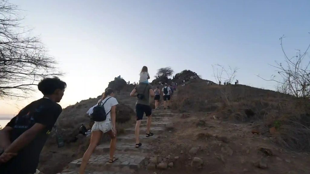 Walkers climbing the stepped path up Padar
